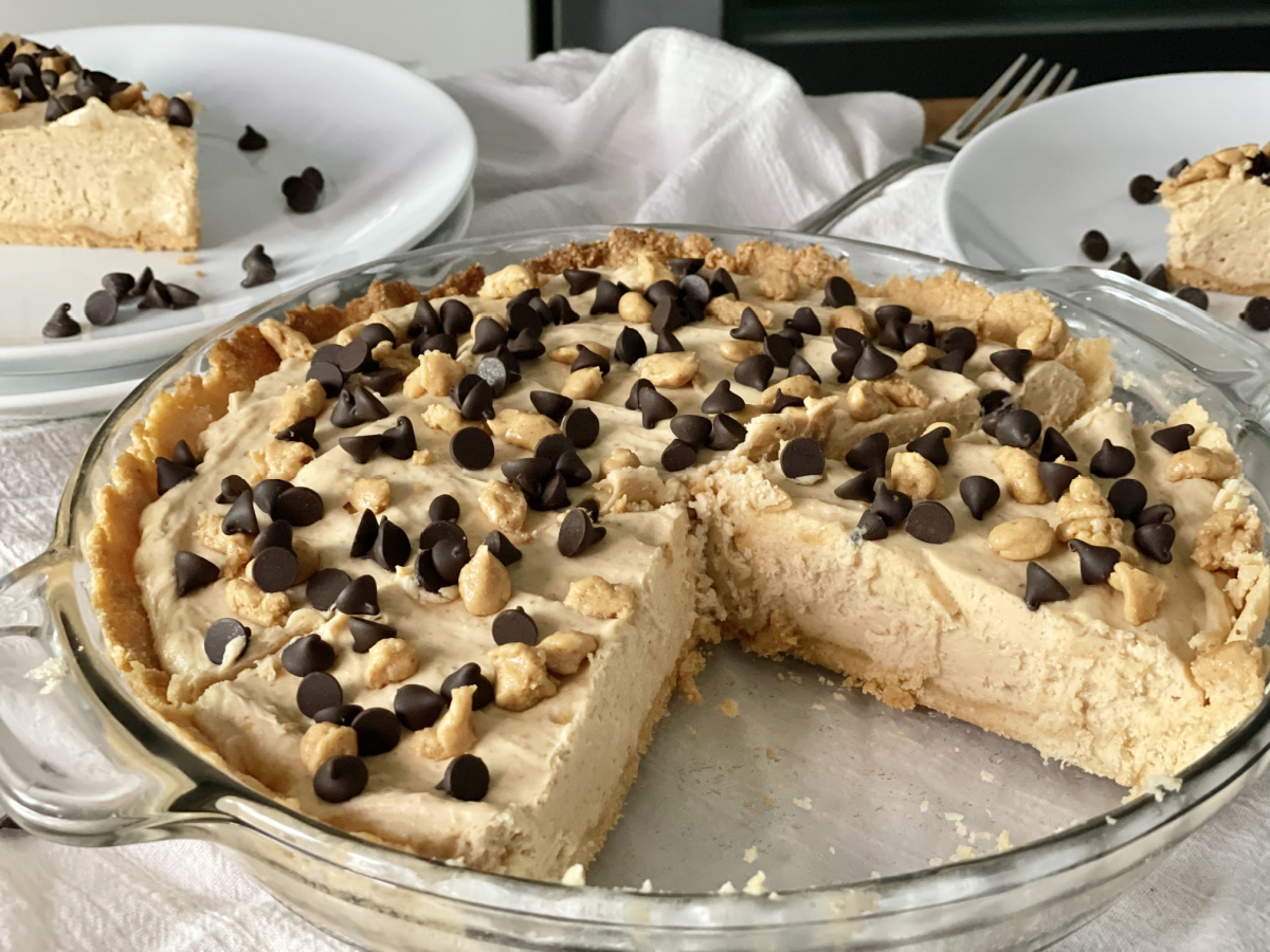 Keto peanut butter pie with a slice taken out