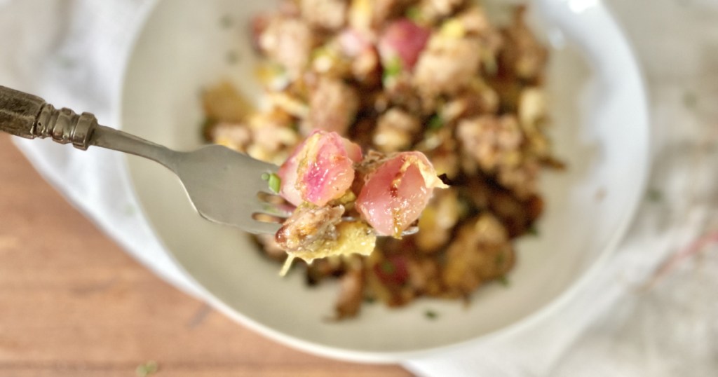 bite of sausage hash on a fork