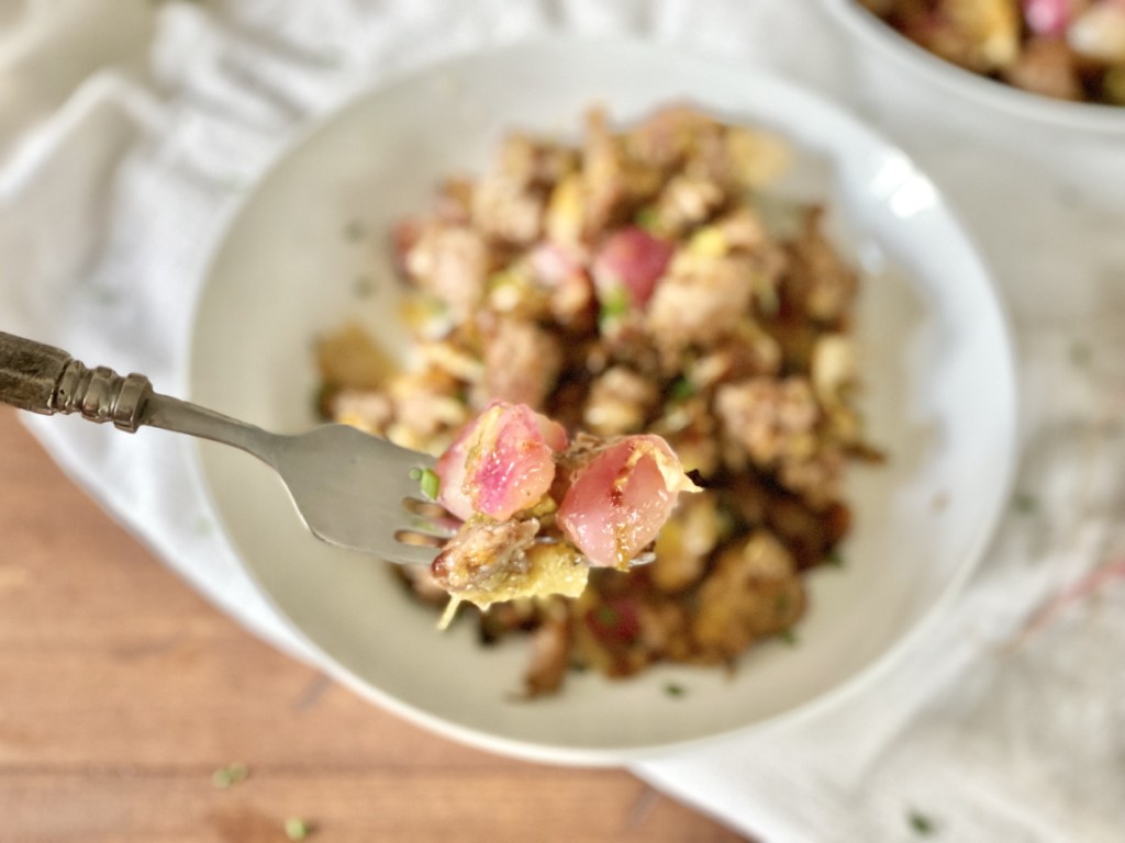 bite of sausage hash on a fork