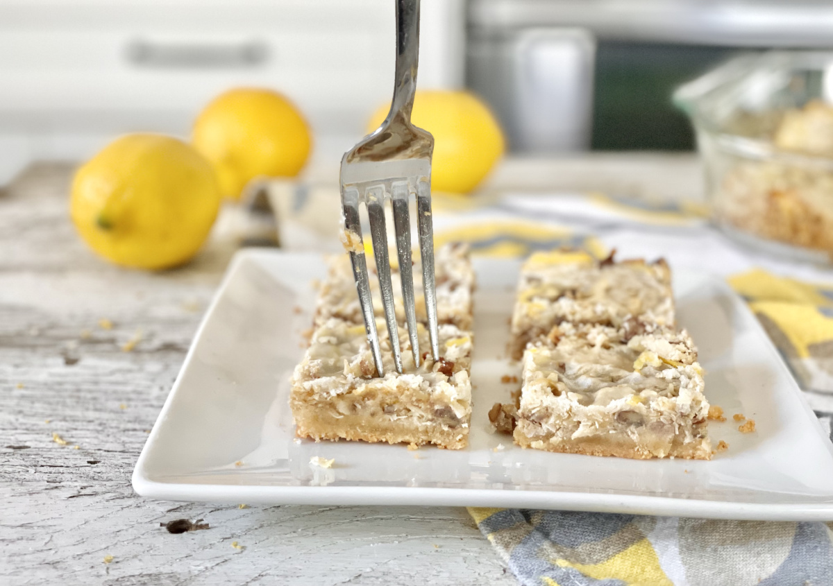 taking a fork bite of keto coconut Lemon Bars