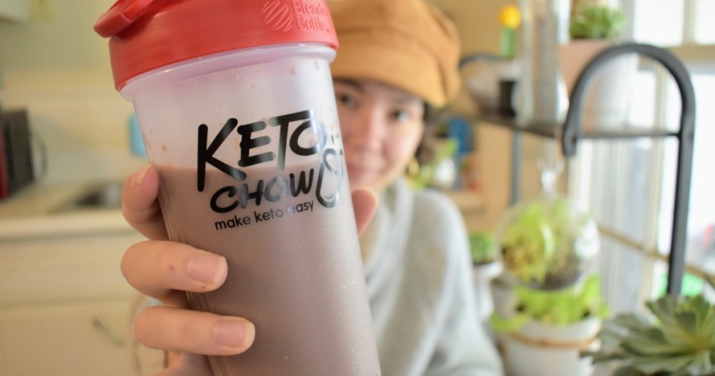 holding Keto Chow cup