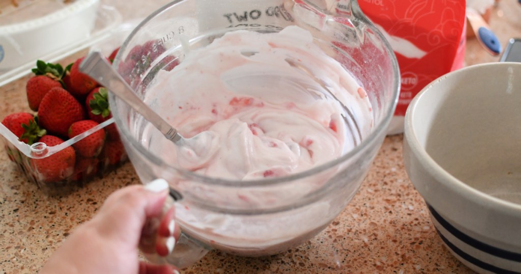 mixing keto strawberry yogurt pie