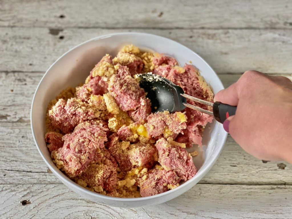 mixing pork rinds into ground beef for classic keto meatloaf