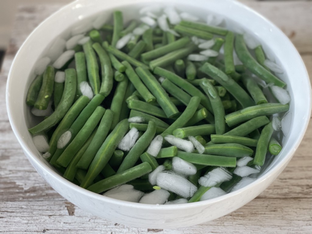 green beans in an ice bath