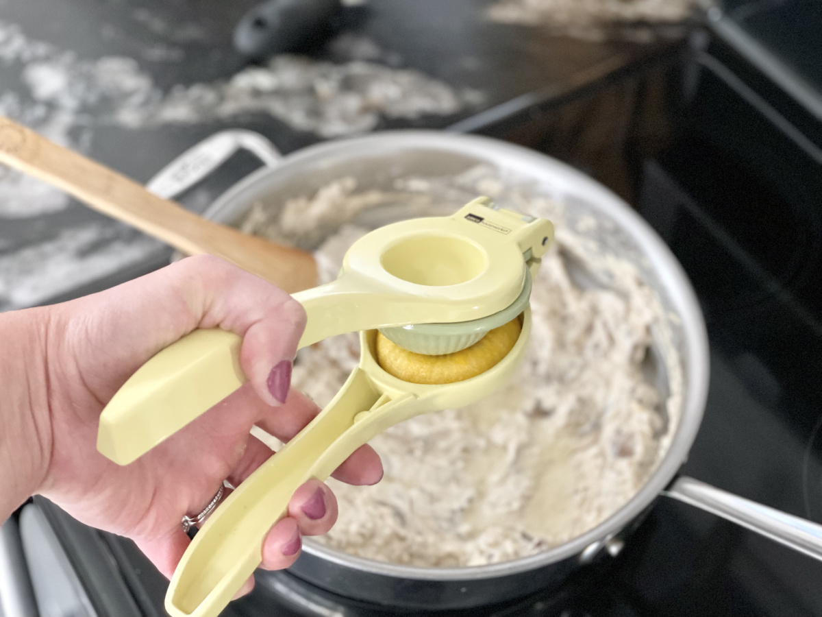 adding lemon juice to a cream sauce