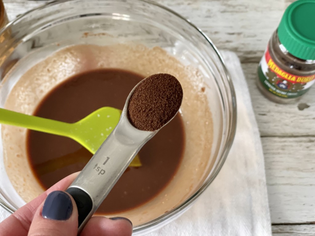 adding espresso powder to Keto Kitchen Sink Brownies batter