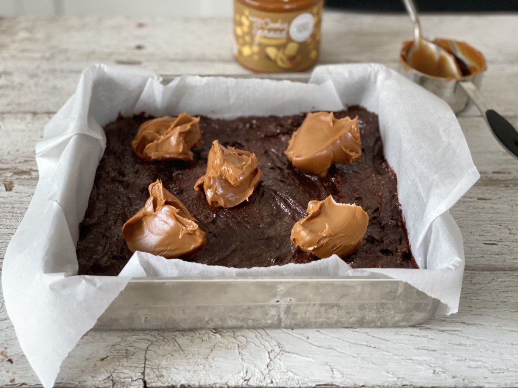 adding keto cookie spread to Keto Kitchen Sink Brownies batter