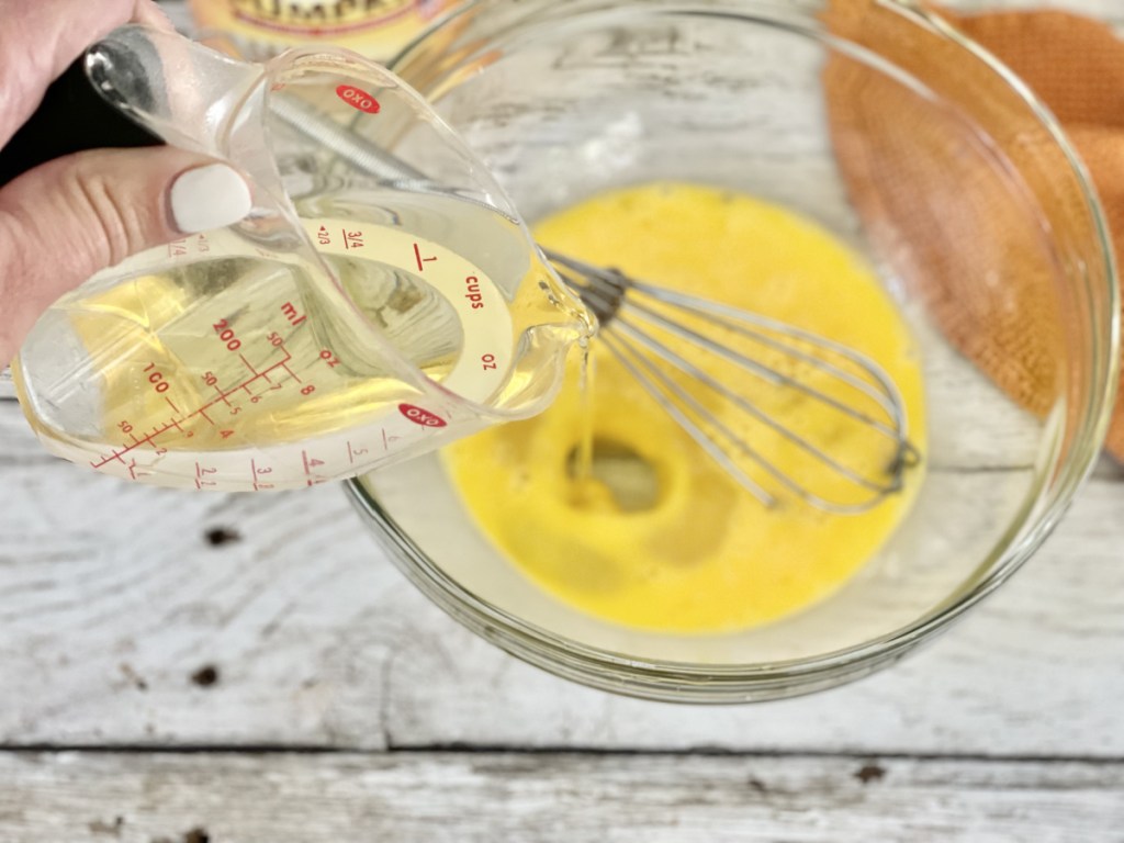 pouring avocado oil into a bowl