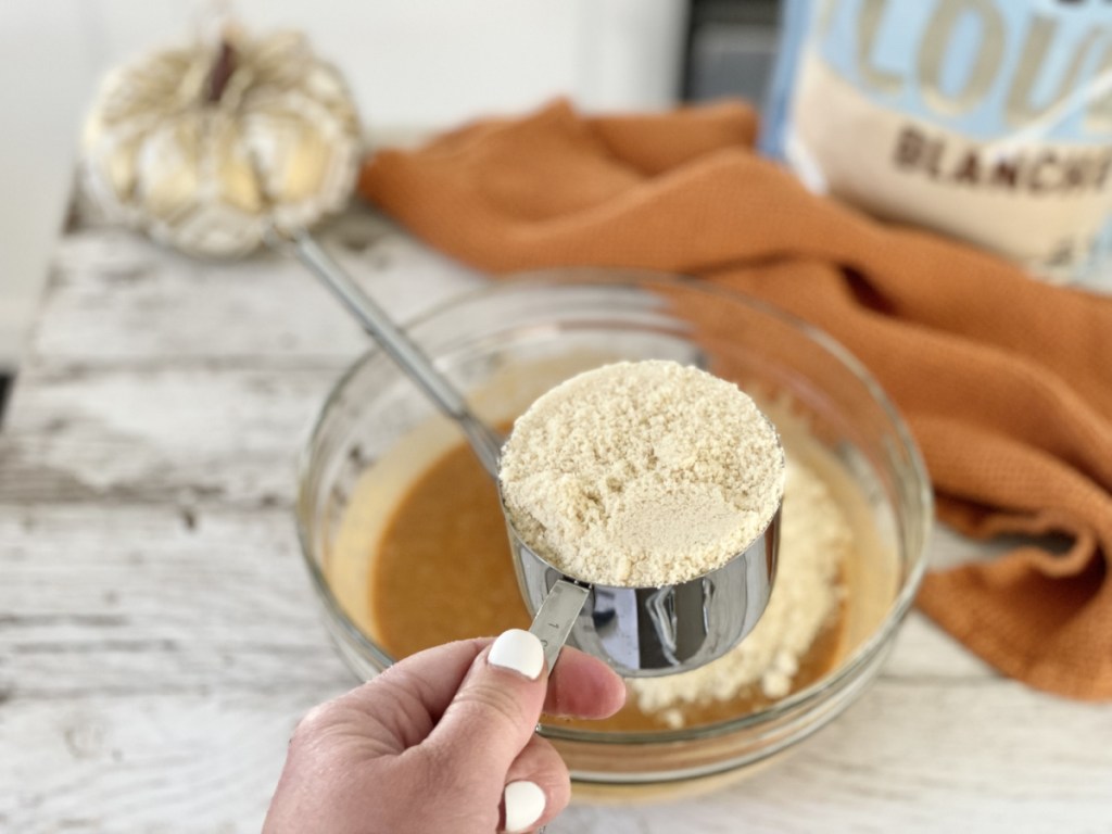 adding almond flour to keto pumpkin bread batter