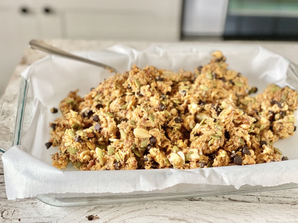 Keto Pumpkin Chocolate Chip Granola Bars batter in baking dish