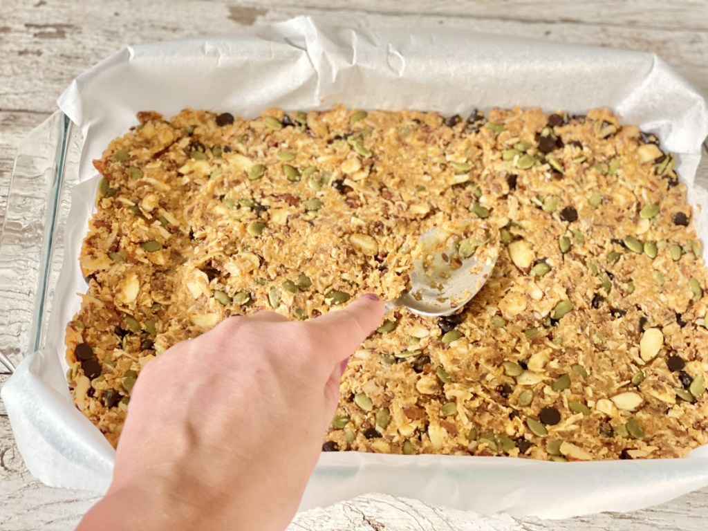 flattening batter for Keto Pumpkin Chocolate Chip Granola Bars