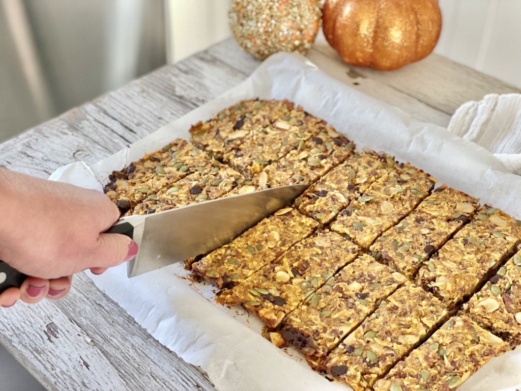 slicing Keto Pumpkin Chocolate Chip Granola Bars