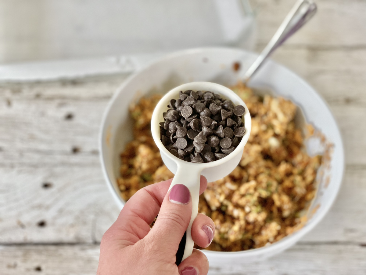 adding chocolate chips to a bowl