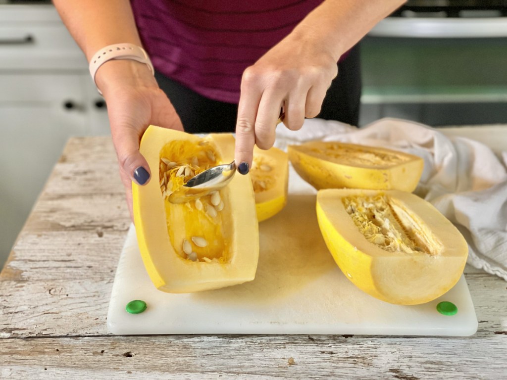 scraping out spaghetti squash