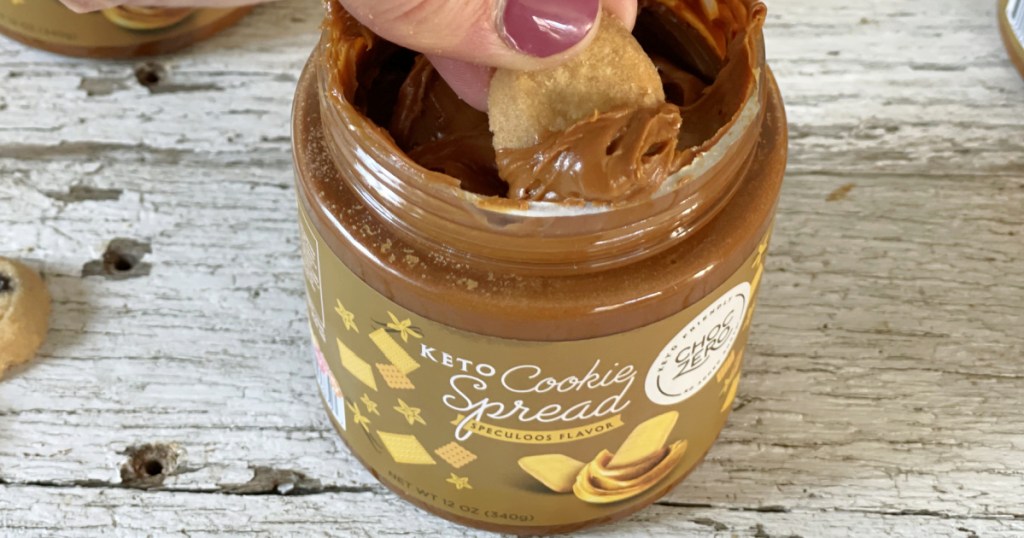 dipping cookie with keto cookie spread