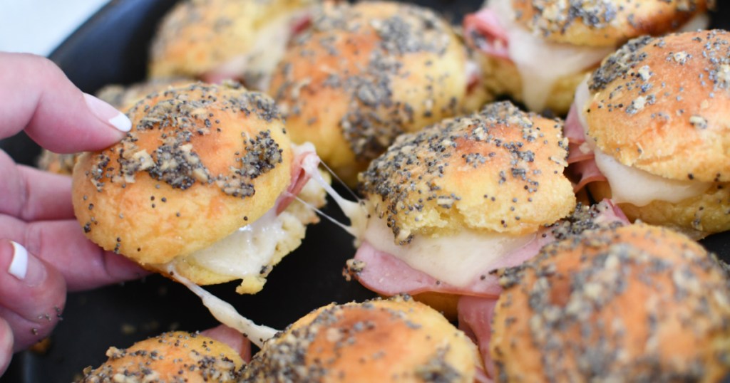 pulling apart keto sliders on a tray