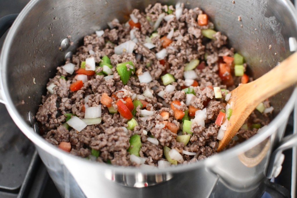 meat with peppers an onions in a large pot