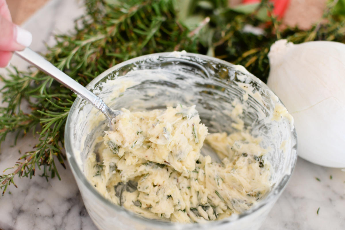 mixing herb butter for turkey