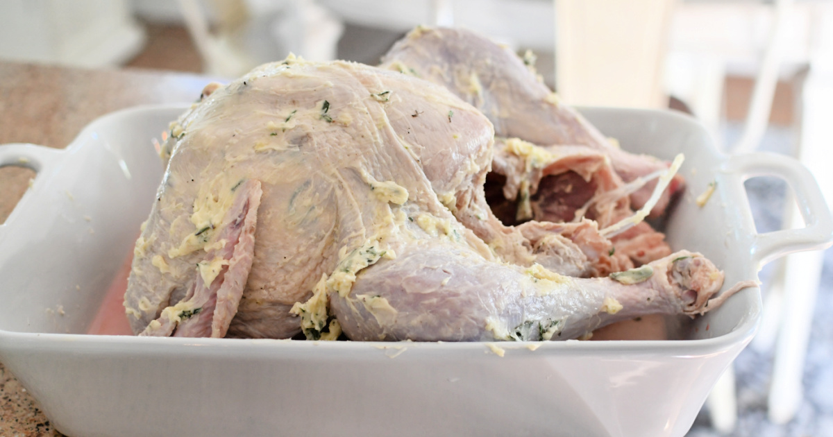 roast turkey with herb butter ready for oven