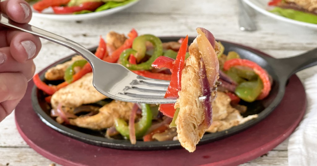 bite on a fork of Easy keto skillet chicken fajitas, a low carb Mexican food
