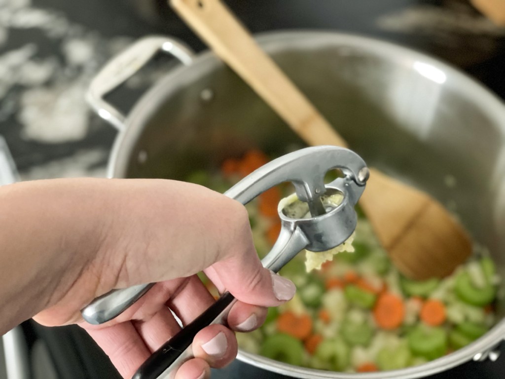 adding garlic to pan for Keto Chicken Noodle Soup