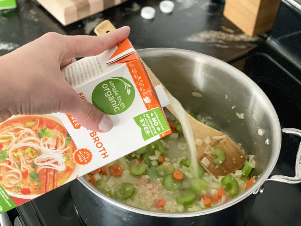 adding chicken broth to pan for Keto Chicken Noodle Soup