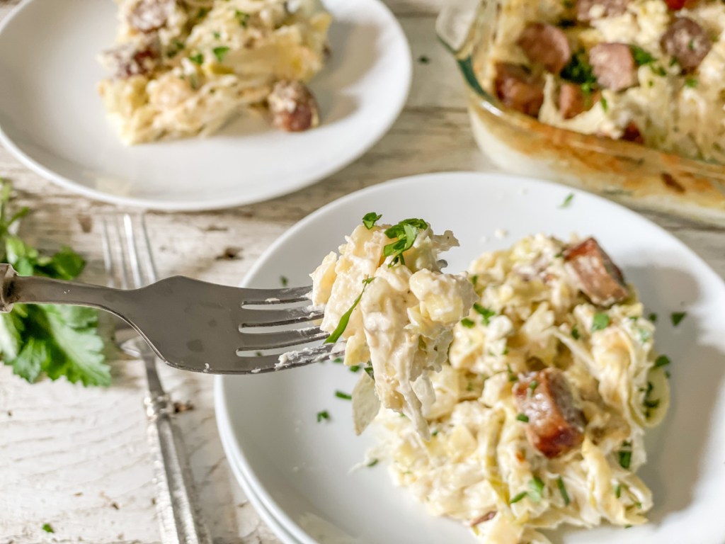 bite on a fork of Keto Sausage Alfredo with Cabbage