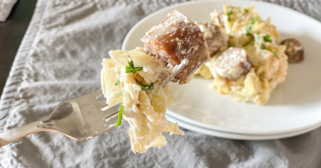 fork bite of Keto Sausage Alfredo with Cabbage