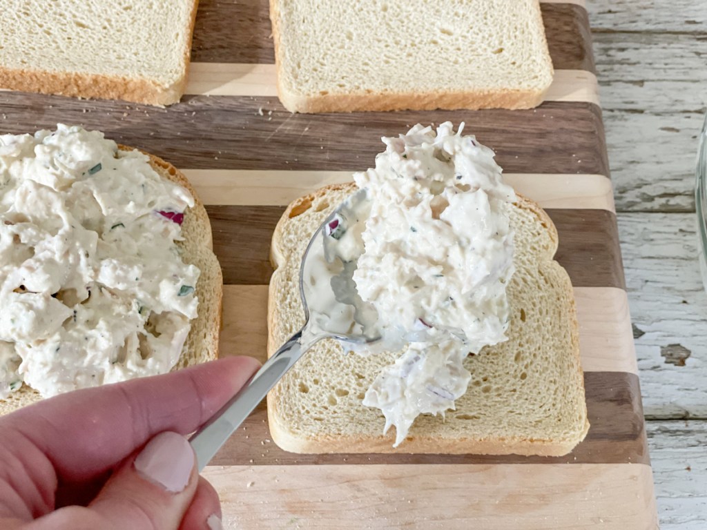 putting tuna on bread for Keto Tuna Melt