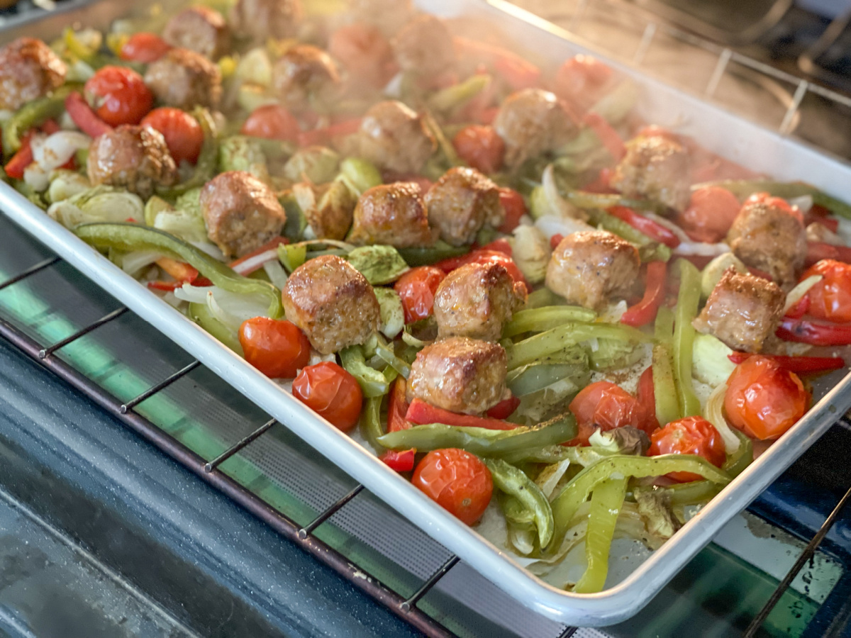 steaming keto Sheet Pan Meal with Sausage and peppers in the oven