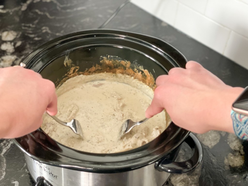 shredding keto cream cheese chicken in crockpot