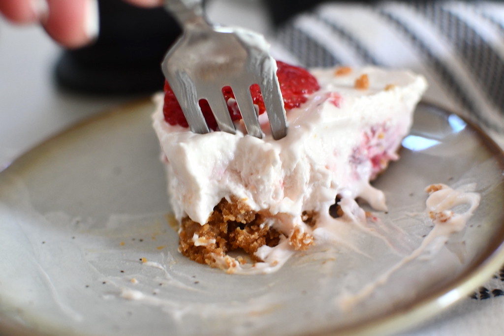 taking a bit of keto yogurt cream pie 