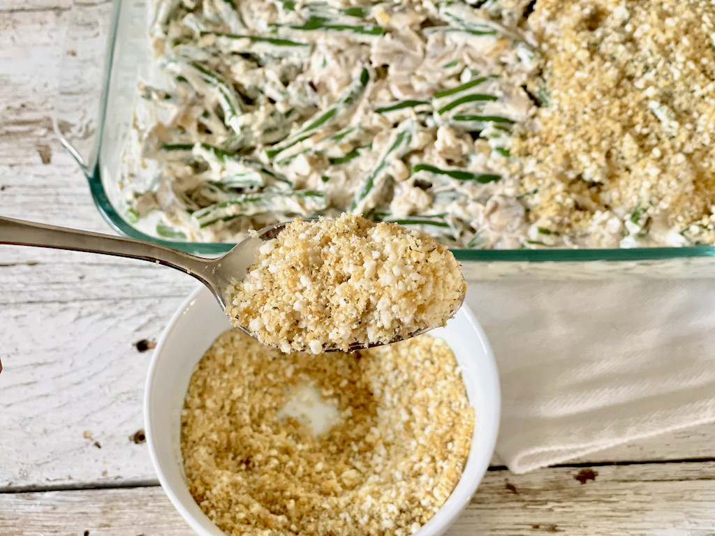 putting low-carb topping on green bean casserole 