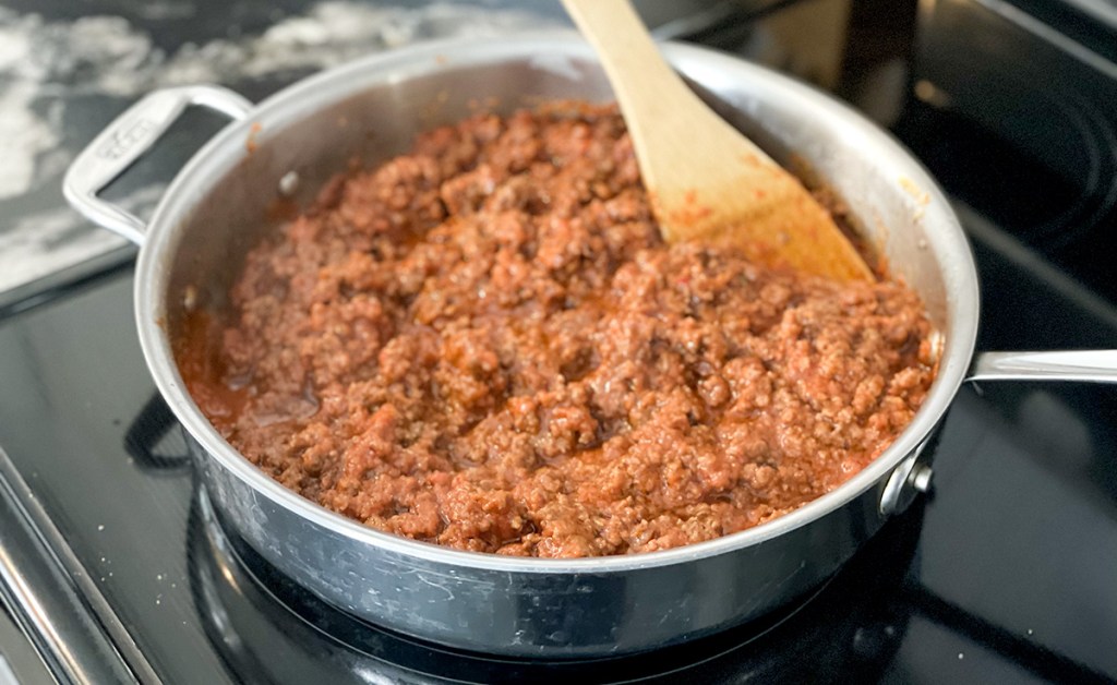 beef and marinara sauce in pan