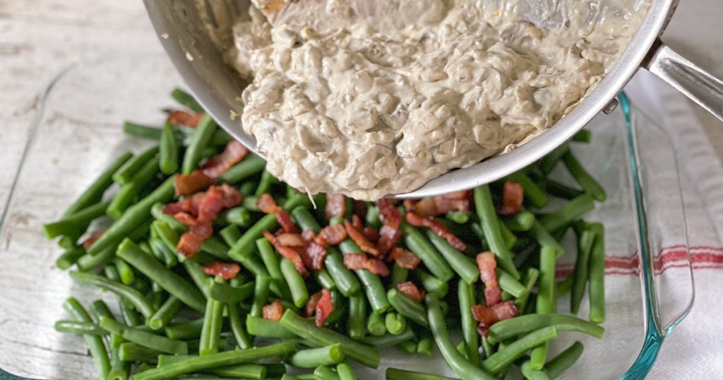 pouring keto cream of mushroom soup over bacon and green beans