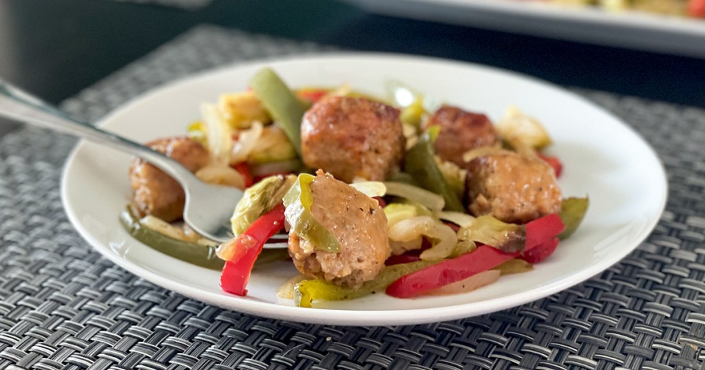 forkful of sheet pan keto Italian sausage and peppers