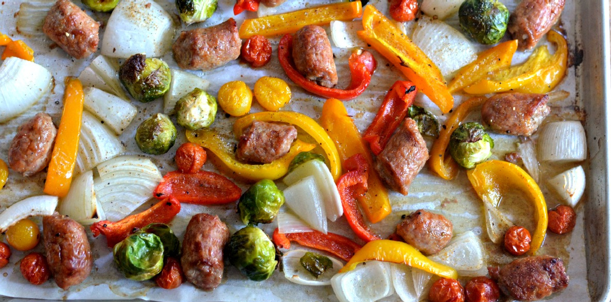 keto sheet pan meal with sausage and peppers on baking sheets