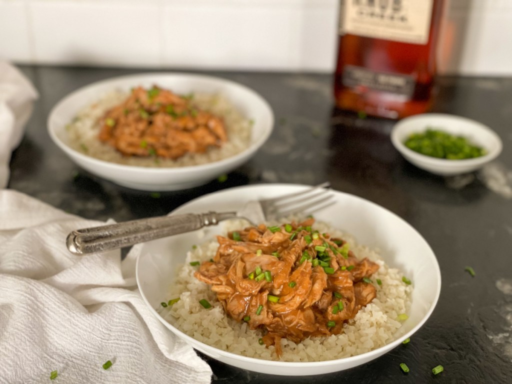 keto crockpot bourbon chicken plated on a counter