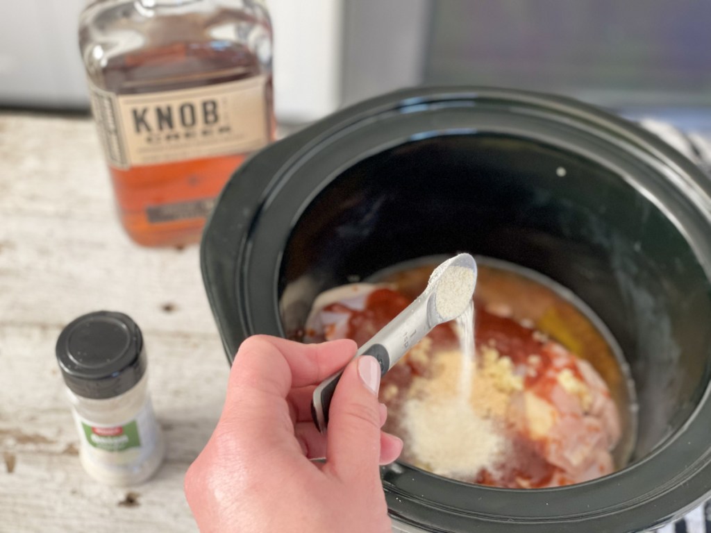 adding seasonings to keto crockpot bourbon chicken