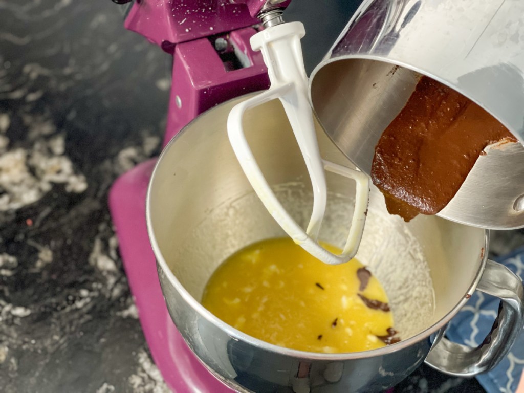 adding melted chocolate to wet ingredients for keto mint chocolate cupcakes