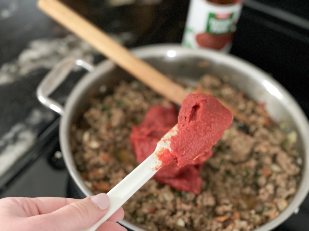adding tomato paste to skillet for slow cooker low-carb lasagna