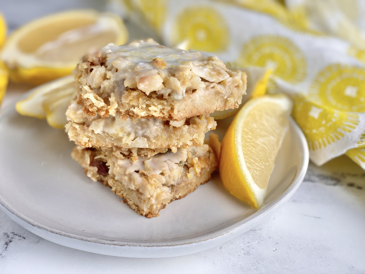 keto coconut lemon bars stacked on a plate