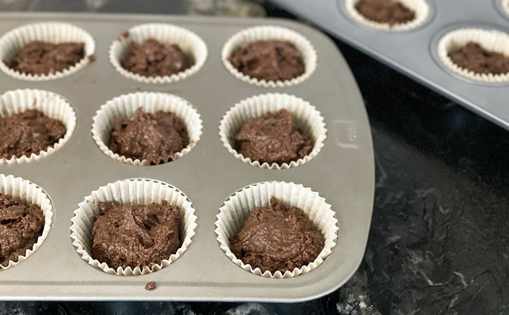 cupcakes tins filled with chocolate batter