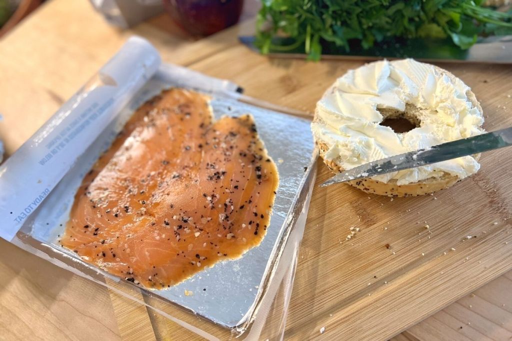 Trader Joe's Everything but the Bagel salmon next to bagel with cream cheese