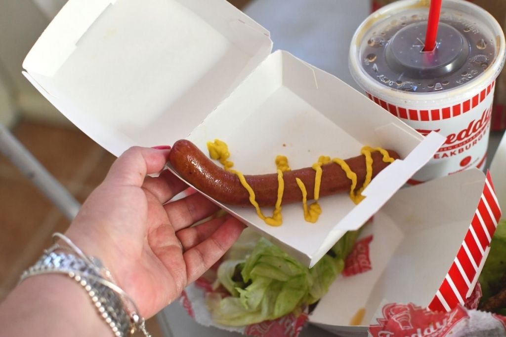 Freddy's hot dog in a to-go box