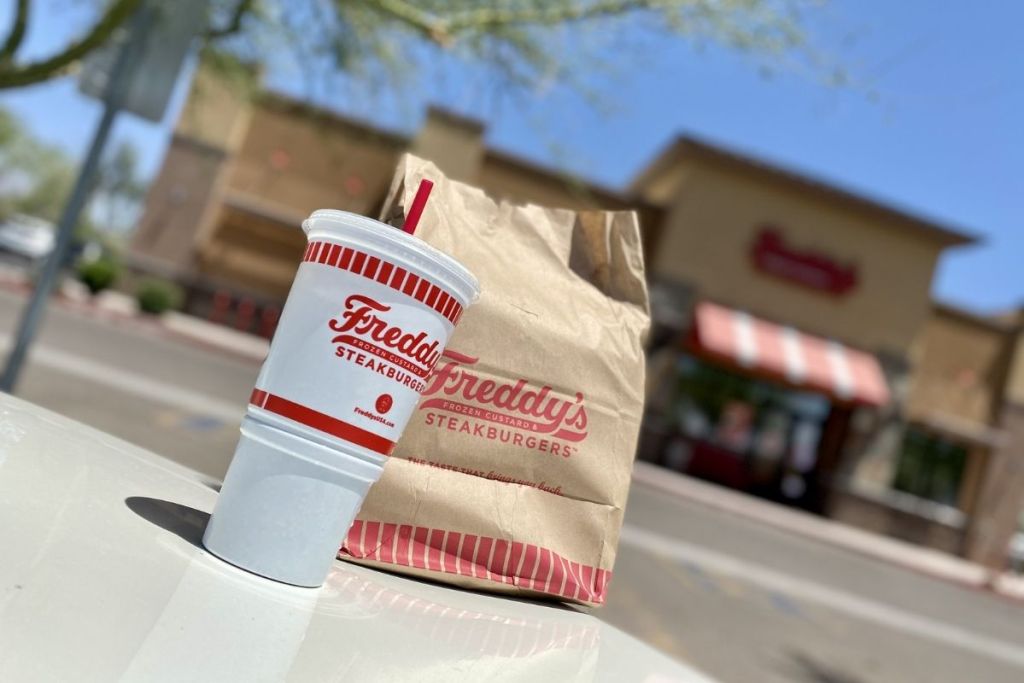 Freddy's Steakburgers to-go bag and soda cup