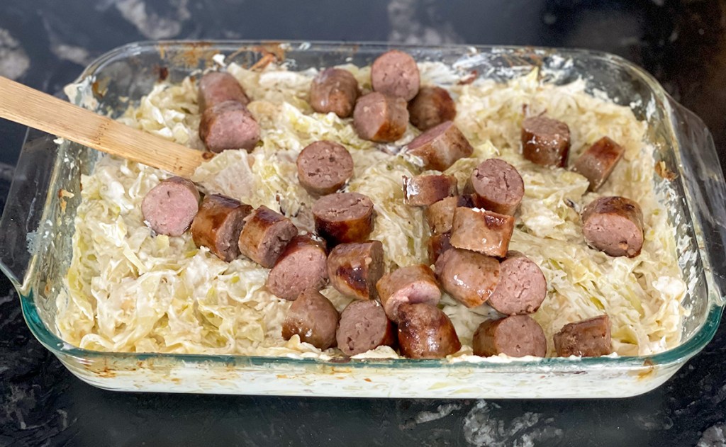 adding sausage to cabbage fettuccine alfredo