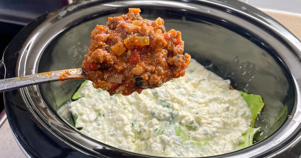 spoonful of marinara sauce for keto crockpot lasagna