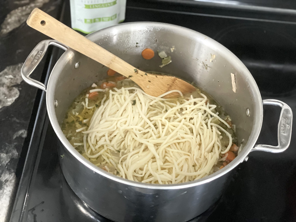 putting Palmini noodles in keto chicken soup 