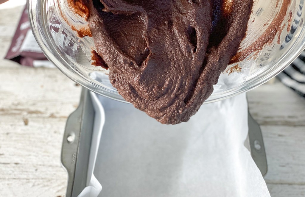 pouring in batter to pan